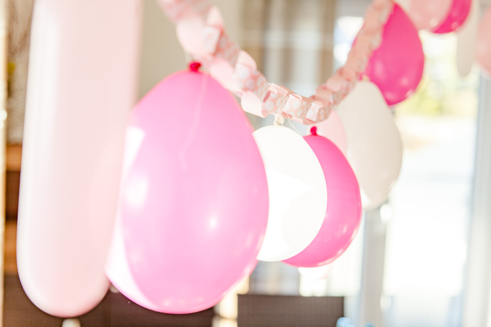 balloons tied to paper streamers