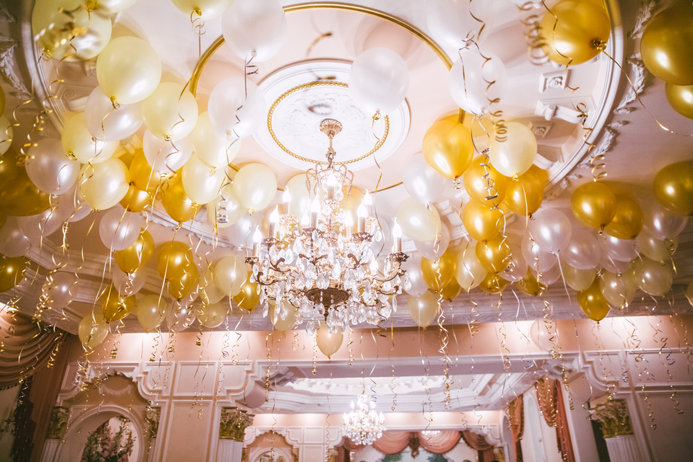 white and gold ceiling balloons